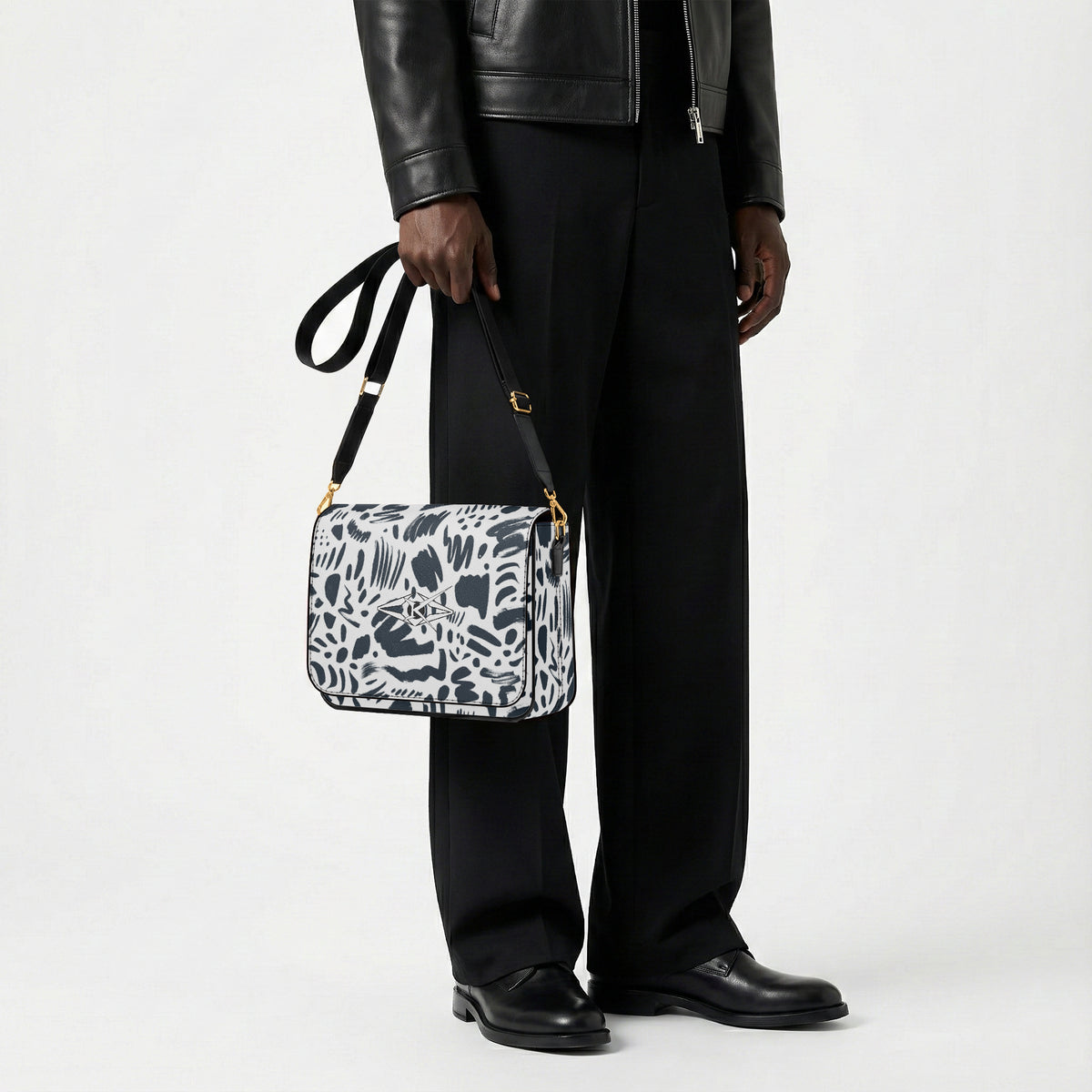 Person holding a patterned bag against a white background