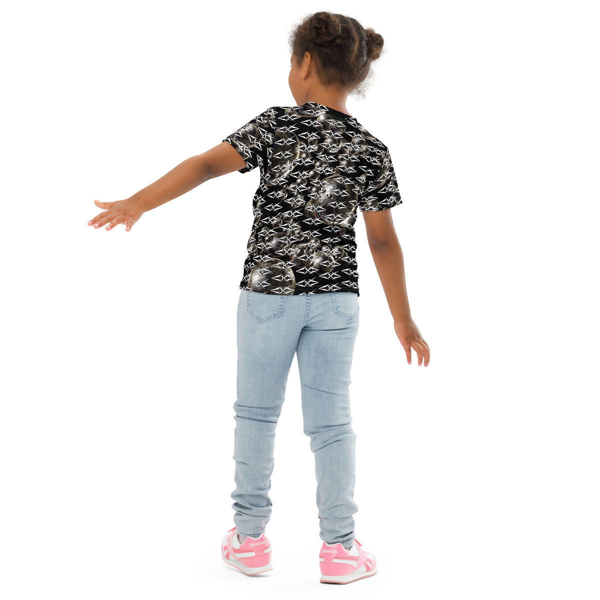 Child wearing a black patterned shirt and light blue jeans on a white background
