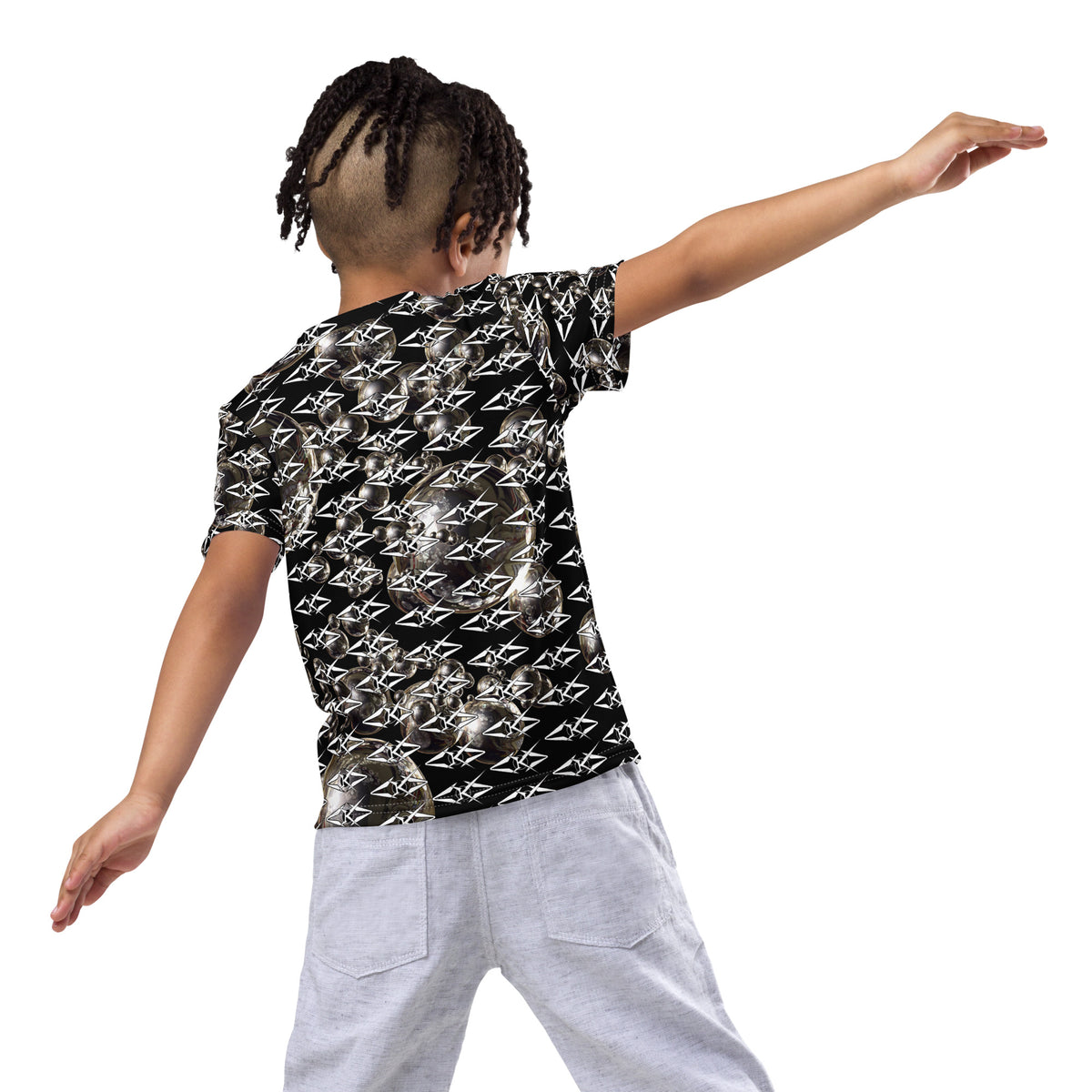 Person wearing a black patterned shirt on a white background