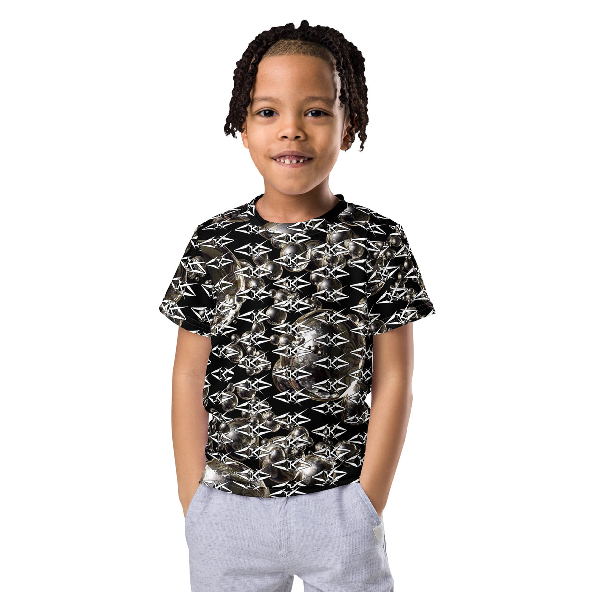 Child wearing a black and white patterned shirt on a white background