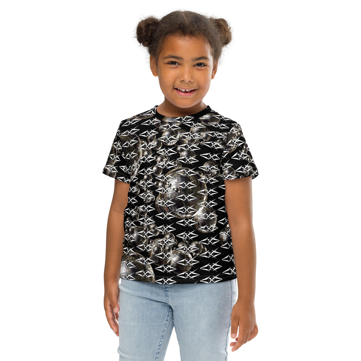 Child wearing a black t-shirt with white geometric pattern on a white background